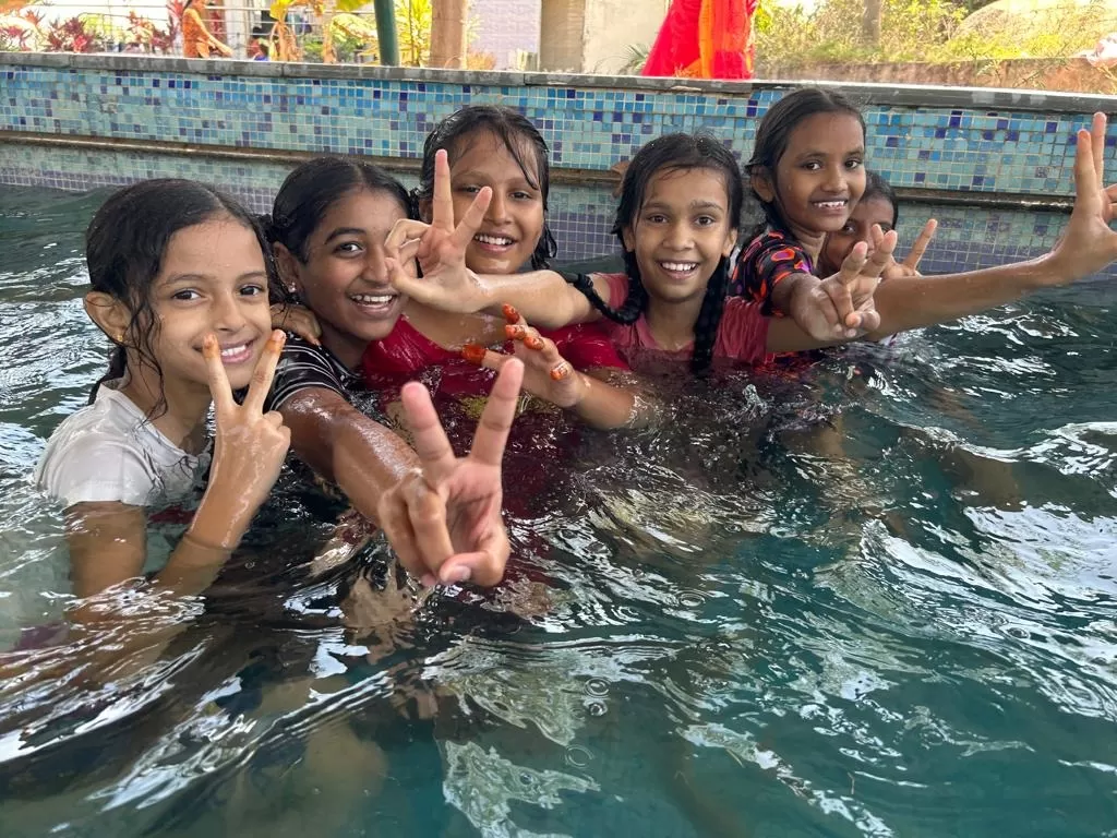Queens Global School students enjoying swimming classes in Kavadiguda Hyderabad, a top CBSE school near Secunderabad offering sports and holistic growth.